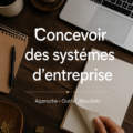 Femme à son bureau, concentrée sur des plans de systèmes d'entreprise pour améliorer la productivité.